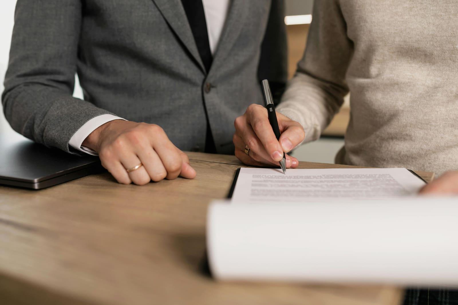 Signing business formation paperwork at a desk