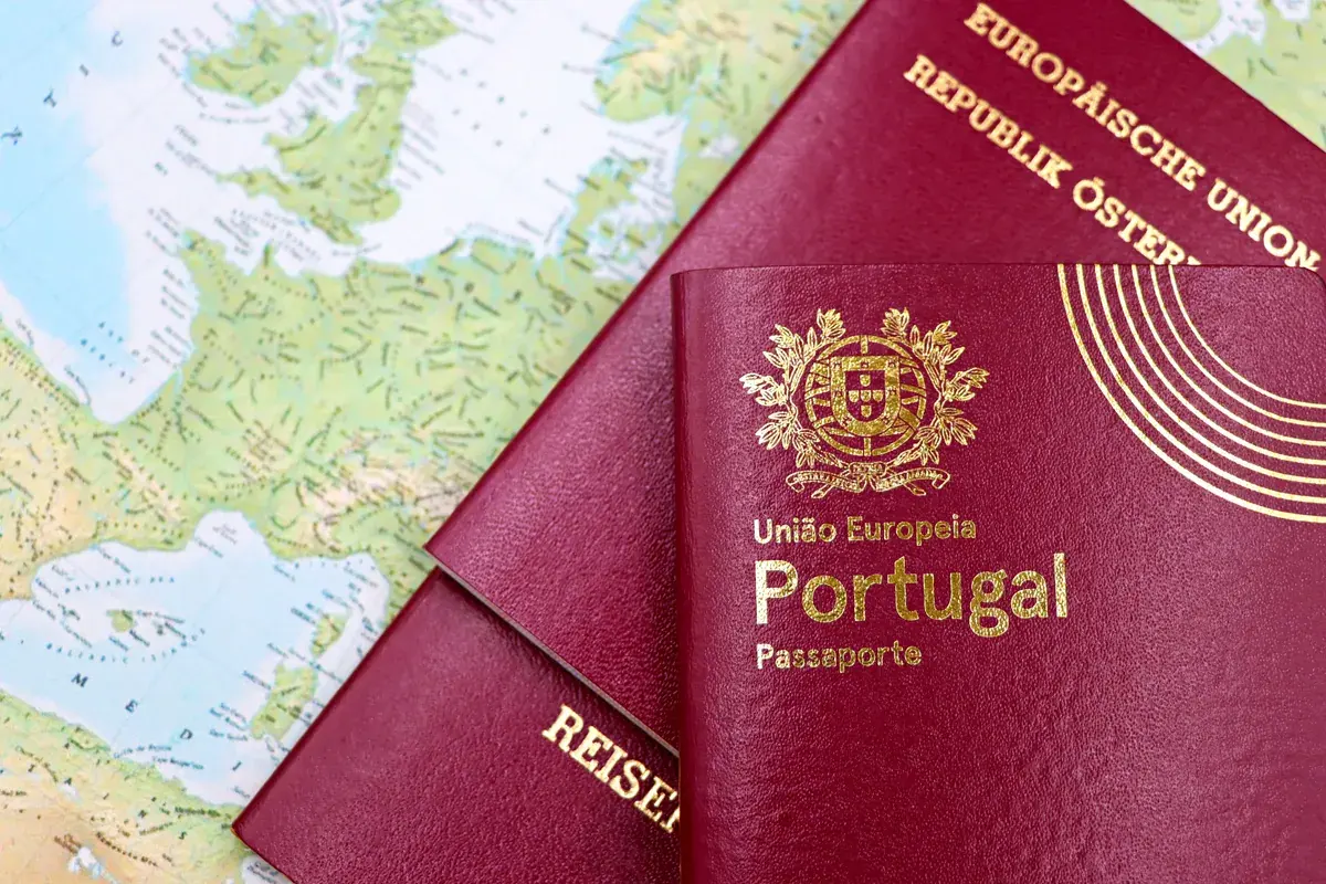 Two European passports resting on a printed map of Europe