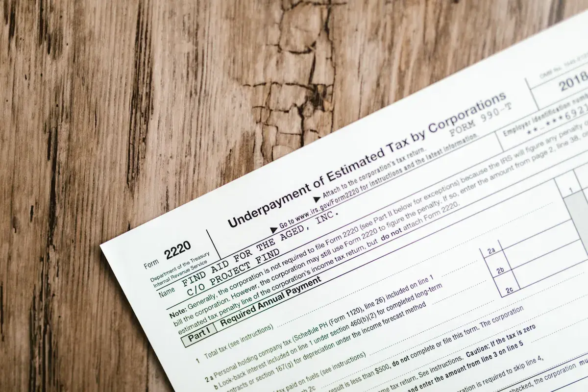 Close-up of a printed IRS corporate tax form resting on a wooden desk