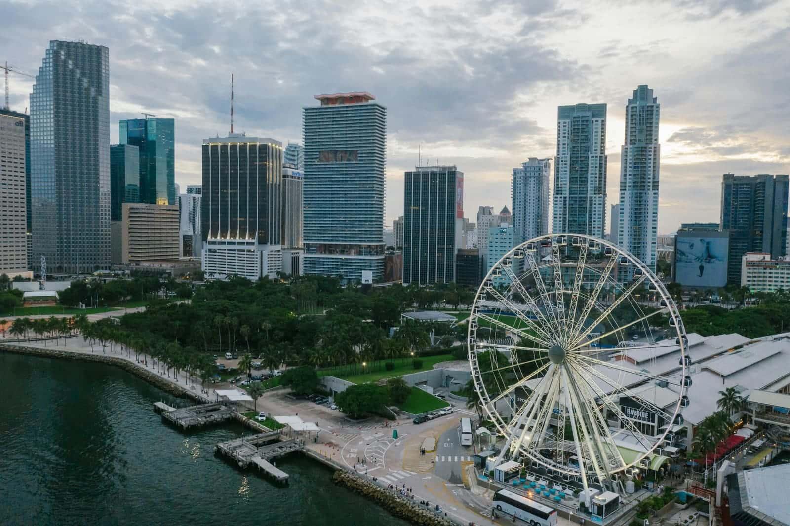 Aerial view of the downtown Miami skyline along Biscayne Bay at dusk
