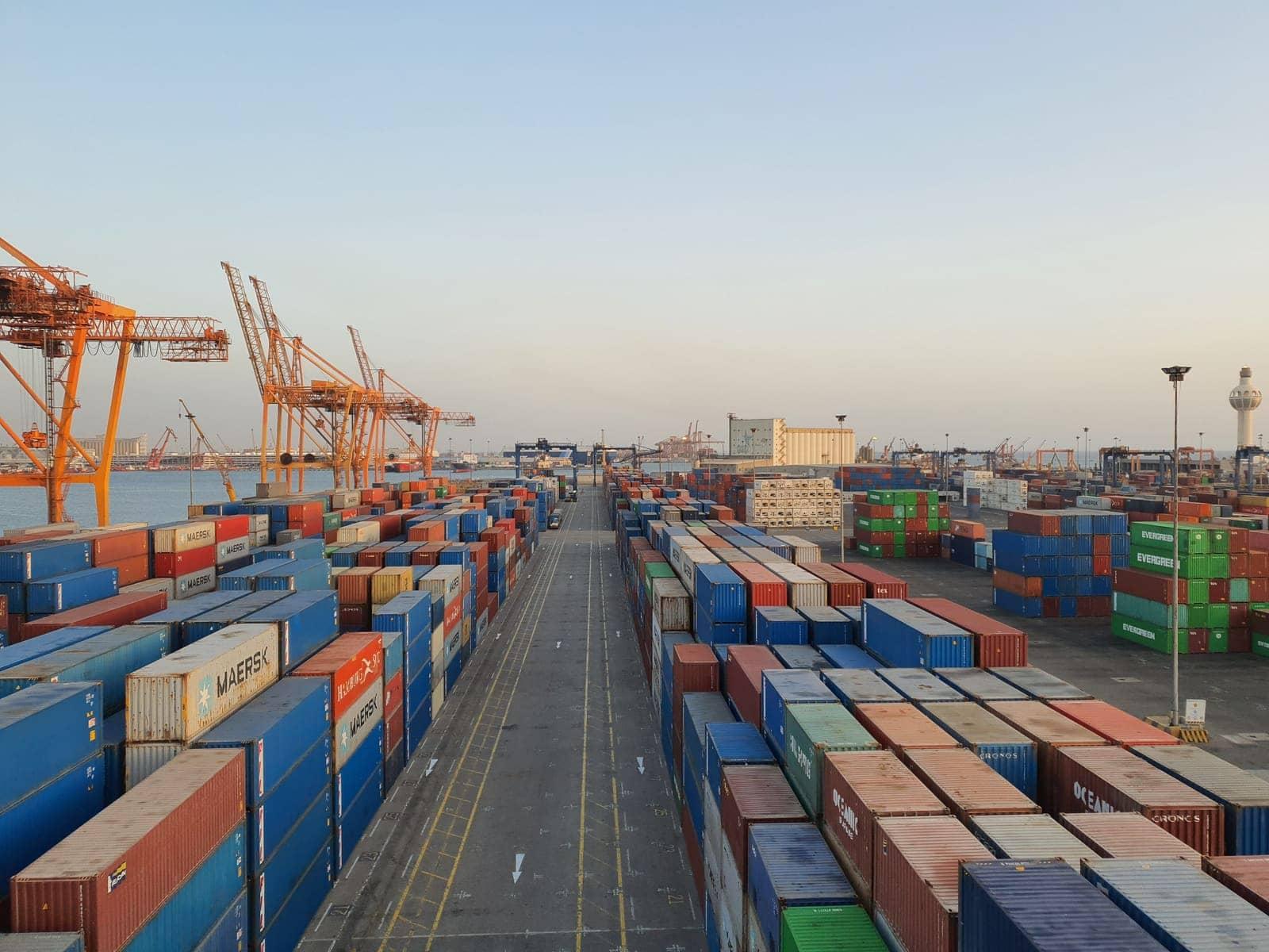 Shipping containers stacked at a cargo port.