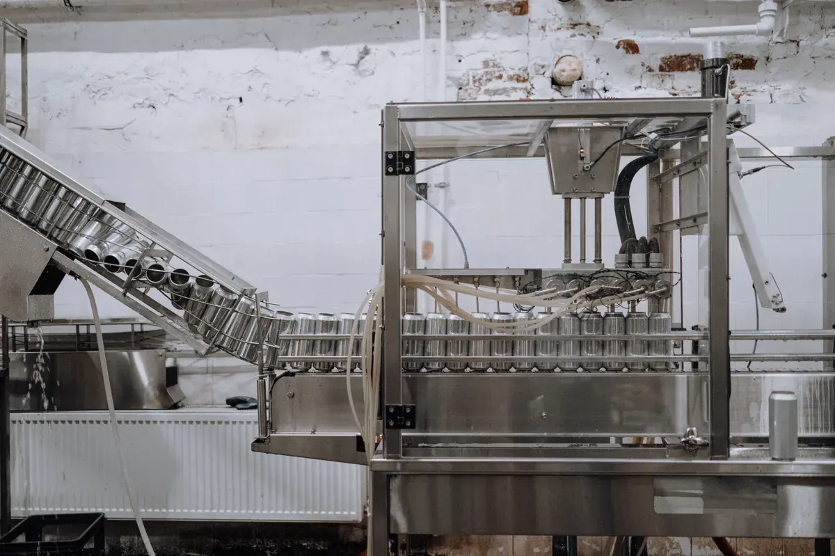 Automated beverage can packaging line inside a modern production facility