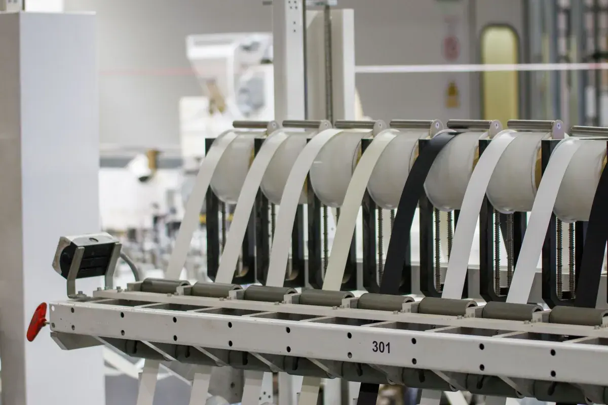 Modern industrial machine in operation inside a manufacturing facility with advanced controls